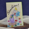Sveikinimo atvirukas "Klounas su gėle"
